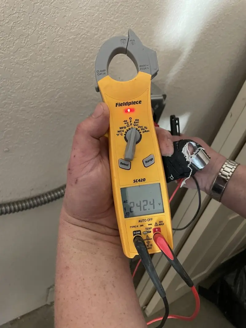 Voltage testing with clamp meter during Whole House Surge Protector in Stevens Point